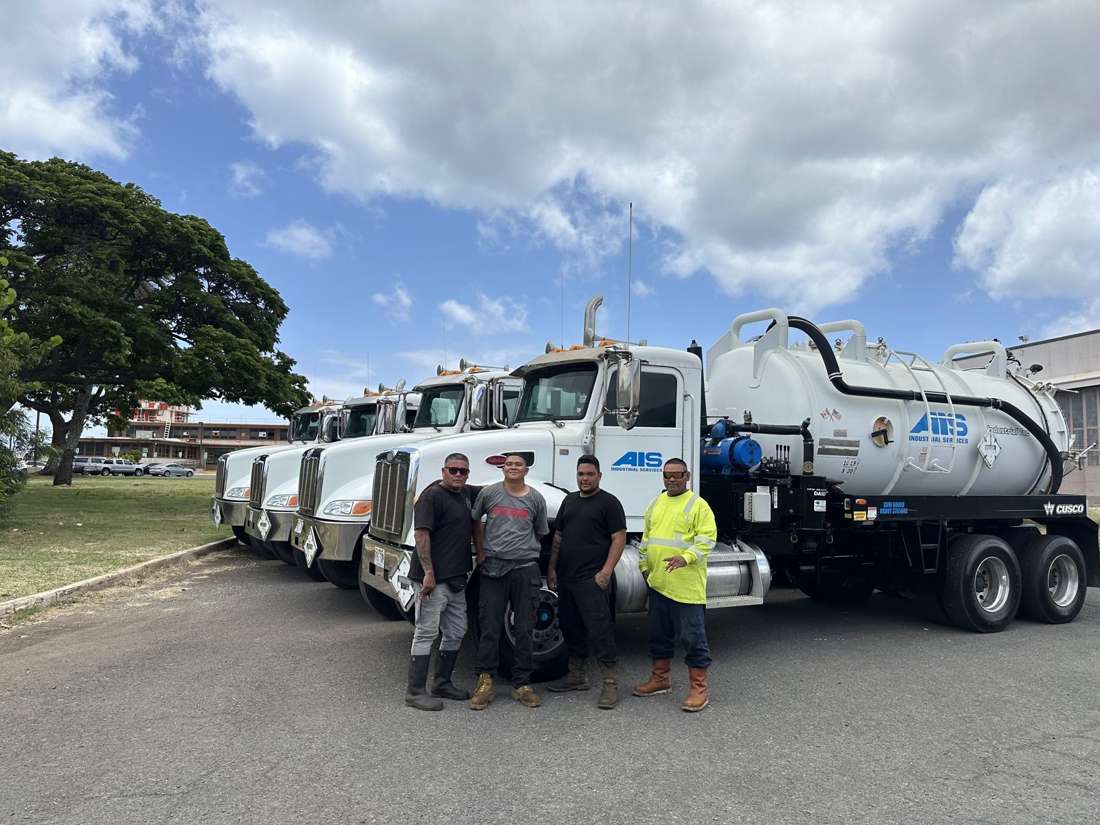 AIS Hawaii crew in front of the vacuum truck fleet